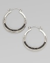 From the Eclipse Collection. Elegant hoops with an arc of faceted deep blue sapphires set in polished sterling silver.Blue sapphireSterling silverDiameter, about 1¾ PiercedImported