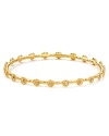 Embrace the season's eclectic approach to accessorizing with this hammered gold-plated bangle from Melinda Maria. Designed to add a touch of luxe to every look this piece is adorned with striking crystal stations.