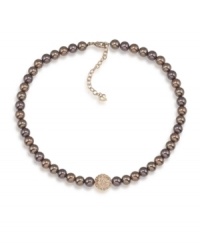 Autumnal appeal. Gorgeous brown glass pearls and a sparkling fireball charm make this Carolee necklace a perfect addition for your fall wardrobe. Crafted in gold tone mixed metal. Approximate length: 16 inches + 2-inch extender. Autumnal appeal. Gorgeous brown glass pearls and a sparkling fireball charm make this Carolee necklace a perfect addition for your fall wardrobe. Crafted in gold tone mixed metal. Approximate length: 16 inches + 2-inch extender.