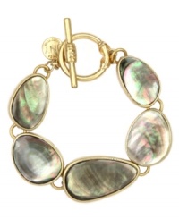 Boho, free-spirited style. This captivating bracelet from Jones New York flaunts brown mother-of-pearl shell accents set in worn gold tone mixed metal with toggle closure. Approximate length: 7-3/4 inches. Boho, free-spirited style. This captivating bracelet from Jones New York flaunts brown mother-of-pearl shell accents set in worn gold tone mixed metal with toggle closure. Approximate length: 7-3/4 inches.