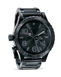 A cool design with a utilitarian side, Nixon's matte-black chronograph is a strong choice. This oversized watch looks sleek worn with a suit and stylish worn with jeans and a tee. A cool design with a utilitarian side, Nixon's matte-black chronograph is a strong choice. This oversized watch looks sleek worn with a suit and stylish worn with jeans and a tee.
