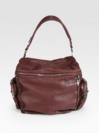 A gorgeous silhouette, in vintage-style washed leather with industrial zipper details.Top handle, 7 dropTop zip-around closureFour outer zip compartmentsOne inner zip compartmentFully lined11W X 9H X 6DImported A gorgeous silhouette, in vintage-style washed leather with industrial zipper details.Top handle, 7 dropTop zip-around closureFour outer zip compartmentsOne inner zip compartmentFully lined11W X 9H X 6DImported