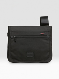 This slim, sleek design works well for carrying your essentials during travel or everyday use. Made from rugged ballistic nylon, it can be worn over the shoulder or across the body. Magnetic flap closure Adjustable shoulder strap Interior, exterior accessories pockets 11W X 12¼H X 1¾D Imported This slim, sleek design works well for carrying your essentials during travel or everyday use. Made from rugged ballistic nylon, it can be worn over the shoulder or across the body. Magnetic flap closure Adjustable shoulder strap Interior, exterior accessories pockets 11W X 12¼H X 1¾D Imported