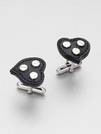 Heart-shaped cuff links set in signature saffiano leather with metal screw details in the center.Brass/glassAbout ¾ diam.Made in the United Kingdom Heart-shaped cuff links set in signature saffiano leather with metal screw details in the center.Brass/glassAbout ¾ diam.Made in the United Kingdom