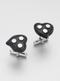 Heart-shaped cuff links set in signature saffiano leather with metal screw details in the center.Brass/glassAbout ¾ diam.Made in the United Kingdom