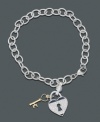 Lock your heart...but don't throw away the key. Keep them side by side on this darling sterling silver bracelet featuring a diamond heart charm (1/5 ct. t.w.) and 14k gold key. Approximate length: 7 inches. Approximate charm drop: 7/8 inch.