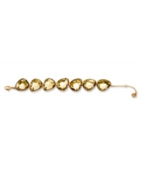 Add a touch of luxury in lustrous sparkle. Swarovski's exquisite gold tone mixed metal bracelet gleams in warm golden tones. The shimmering row of sumptuous Desert Glow crystals in pinch prong setting adds a touch of glamour. Approximate length: 6-1/4 inches. Add a touch of luxury in lustrous sparkle. Swarovski's exquisite gold tone mixed metal bracelet gleams in warm golden tones. The shimmering row of sumptuous Desert Glow crystals in pinch prong setting adds a touch of glamour. Approximate length: 6-1/4 inches.
