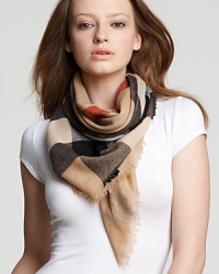 Wrap yourself in style with a sheer woven wool scarf featuring Burberry's iconic check pattern in the classic trench hue. Wrap yourself in style with a sheer woven wool scarf featuring Burberry's iconic check pattern in the classic trench hue.