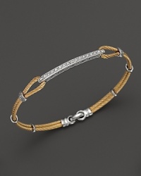 From the Classique Collection, a stackable bangle with diamonds in 18K white gold on stainless steel cable with yellow PVD. Designed by Charriol. From the Classique Collection, a stackable bangle with diamonds in 18K white gold on stainless steel cable with yellow PVD. Designed by Charriol.