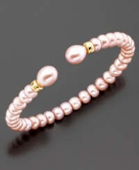 The perfect romantic accent to your lovely look; this bracelet features beautiful pink cultured freshwater pearls (6-9 mm) set in 14k gold. Approximate diameter: 2 inches. Approximate length: 7 inches. The perfect romantic accent to your lovely look; this bracelet features beautiful pink cultured freshwater pearls (6-9 mm) set in 14k gold. Approximate diameter: 2 inches. Approximate length: 7 inches.
