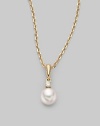 Simple and lovely, a white, round cultured Akoya pearl has a sparkling diamond accent, plus a chain and setting of 18k gold. 6mm white round cultured pearl Quality: A+ Diamond, 0.03 tcw 18k yellow gold Length, about 18 Spring ring clasp Imported