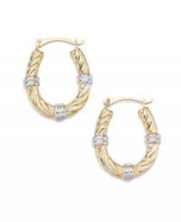 Notched accents give these hoop earrings a segmented look. Set in 14k white and yellow gold.