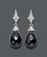 The perfect complement to your little black dress -- these divine drops will create a dramatic effect. Set in 14k white gold, a round-cut diamond (1/3 ct. t.w.) shines against the backdrop of faceted onyx (14 mm x 10 mm). Approximate drop: 1 inch. The perfect complement to your little black dress -- these divine drops will create a dramatic effect. Set in 14k white gold, a round-cut diamond (1/3 ct. t.w.) shines against the backdrop of faceted onyx (14 mm x 10 mm). Approximate drop: 1 inch.