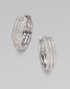 EXCLUSIVELY AT SAKS. A simple yet shimmering design offering three elegant rows of pavé crystal.Crystal Rhodium plated Diameter, about 1 Post-and-hinge back Imported
