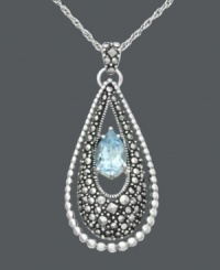 The perfect frame. Genevieve & Grace's elegant teardrop pendant features a blue topaz (1-1/4 ct. t.w.) framed with glittering marcasite. Crafted in sterling silver. Approximate length: 18 inches. Approximate drop: 1-5/8 inches. The perfect frame. Genevieve & Grace's elegant teardrop pendant features a blue topaz (1-1/4 ct. t.w.) framed with glittering marcasite. Crafted in sterling silver. Approximate length: 18 inches. Approximate drop: 1-5/8 inches.