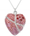 A sweet sentiment. Swarovski's long Roxanne pendant sparkles in light siam and rose crystal. the heart motif is romantically wrapped in a refined rope effect. Crafted in silver tone mixed metal. Approximate length: 29-1/2 inches. Approximate drop: 1-1/5 inches.