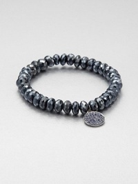 From the Discs Collection. A faceted, almandine garnet beaded bracelet accented with a sapphire accented black rhodium charm. Almandine garnetBlack rhodiumSapphireLength, about 6.5Slip-on styleImported From the Discs Collection. A faceted, almandine garnet beaded bracelet accented with a sapphire accented black rhodium charm. Almandine garnetBlack rhodiumSapphireLength, about 6.5Slip-on styleImported