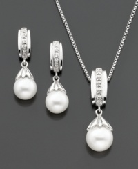 The perfect pairing. This matching set features a graceful pendant and pair of stud earrings that highlight a cultured freshwater pearl (7-8 mm) with round-cut diamond accents for a classic touch. Set in sterling silver. Approximate chain length: 18 inches. Approximate pendant drop: 1/2 inch. The perfect pairing. This matching set features a graceful pendant and pair of stud earrings that highlight a cultured freshwater pearl (7-8 mm) with round-cut diamond accents for a classic touch. Set in sterling silver. Approximate chain length: 18 inches. Approximate pendant drop: 1/2 inch.