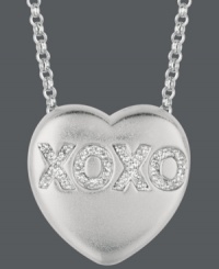 Say it from the heart. Sweethearts' adorable heart-shaped pendant expresses more that just great style with the letters XOXO written in round-cut diamonds (1/10 ct. t.w.) across the surface. Pendant crafted in sterling silver. Copyright © 2011 New England Confectionery Company. Approximate length: 16 inches + 2-inch extender. Approximate drop: 5/8 inch. Say it from the heart. Sweethearts' adorable heart-shaped pendant expresses more that just great style with the letters XOXO written in round-cut diamonds (1/10 ct. t.w.) across the surface. Pendant crafted in sterling silver. Copyright © 2011 New England Confectionery Company. Approximate length: 16 inches + 2-inch extender. Approximate drop: 5/8 inch.