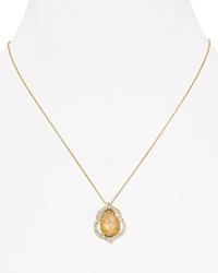 Inspired by the simplicity of colored gem stones, Nadri's crystal-rimmed pendant necklace is an eye-catching adornment that you'll wear now and treasure forever. Inspired by the simplicity of colored gem stones, Nadri's crystal-rimmed pendant necklace is an eye-catching adornment that you'll wear now and treasure forever.