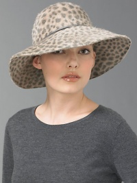 Exotic look in animal-print rabbit hair with leather trim.Brim, about 3.75Dry cleanImportedFur origin: Czech Republic Exotic look in animal-print rabbit hair with leather trim.Brim, about 3.75Dry cleanImportedFur origin: Czech Republic