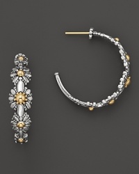18K yellow gold and sterling silver blossoms form these pretty hoops from Konstantino. 18K yellow gold and sterling silver blossoms form these pretty hoops from Konstantino.