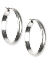 The classic elegance you need, by Jones New York. With a wide, flat design, these sleek hoop earrings bring the change your jewelry box needs. Crafted with silver tone mixed metal. Approximate diameter: 1-1/4 inches. The classic elegance you need, by Jones New York. With a wide, flat design, these sleek hoop earrings bring the change your jewelry box needs. Crafted with silver tone mixed metal. Approximate diameter: 1-1/4 inches.