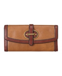 A classic flap clutch design with a chic femme appeal. This vintage inspired wallet by Fossil creates a refined appeal with aged goldtone hardware and a buckle detailed front closure. A classic flap clutch design with a chic femme appeal. This vintage inspired wallet by Fossil creates a refined appeal with aged goldtone hardware and a buckle detailed front closure.