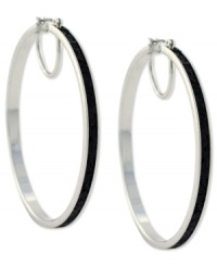 Hit the right notes with these hoop earrings from Jessica Simpson. Crafted from silver tone mixed metal, they also shine with black glitter. Approximate drop: 2-1/2 inches. Approximate diameter: 2-1/2 inches. Hit the right notes with these hoop earrings from Jessica Simpson. Crafted from silver tone mixed metal, they also shine with black glitter. Approximate drop: 2-1/2 inches. Approximate diameter: 2-1/2 inches.