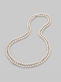 A strand of lustrous white organic pearls goes on and on, down past your waist, to wear long, wrapped or knotted. 8mm white round man-made pearls Length, about 60 Made in Spain