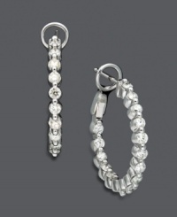 Indulge in a little extra glamour with glittering style. Hoop earrings feature luminous round-cut diamonds (1 ct. t.w.) in a 14k white gold setting. Approximate diameter: 3/4 inch. Indulge in a little extra glamour with glittering style. Hoop earrings feature luminous round-cut diamonds (1 ct. t.w.) in a 14k white gold setting. Approximate diameter: 3/4 inch.