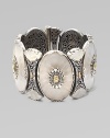 From the Iris Collection. A beautifully elaborate design with carved frosted rock crystals in sterling silver with 18k gold details. Sterling silver 18k gold Sliding pin closure Length, about 7½ Imported 