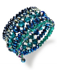 Strut-worthy style. This c.A.K.e. by Ali Khan coil bracelet feature clusters of peacock-inspired faceted glass beads in a hematite tone mixed metal setting. Approximate diameter: 2 inches. Strut-worthy style. This c.A.K.e. by Ali Khan coil bracelet feature clusters of peacock-inspired faceted glass beads in a hematite tone mixed metal setting. Approximate diameter: 2 inches.