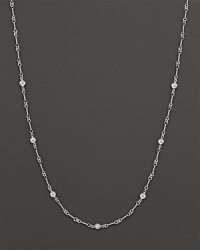 A white gold necklace with bezel-set diamond stations. With signature ruby accent. Designed by Roberto Coin. A white gold necklace with bezel-set diamond stations. With signature ruby accent. Designed by Roberto Coin.