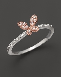 A dainty diamond butterfly ring set in 14K. rose and white gold. A dainty diamond butterfly ring set in 14K. rose and white gold.