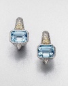 This blue topaz cushion design is accented with white sapphires and 18k gold. Blue topaz18k goldWhite sapphireRhodium-plated sterling silverLength, about .5LeverbackImported 