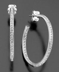 A row of fully faceted crystal accents add luminous sophistication to these otherwise classic hoop earrings. In rhodium-plated silvertone mixed metal. Each measures approximately 1-1/4 inches in diameter. A row of fully faceted crystal accents add luminous sophistication to these otherwise classic hoop earrings. In rhodium-plated silvertone mixed metal. Each measures approximately 1-1/4 inches in diameter.
