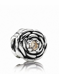 Pandora's delicately carved sterling silver rose charm features a sparking champagne zirconia center. Pandora's delicately carved sterling silver rose charm features a sparking champagne zirconia center.