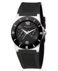 Modern, confident style by Kenneth Cole New York. This watch features a black polyurethane strap and stainless steel round case. Stick indices at bezel. Black dial with logo, numerals at twelve o'clock and six o'clock, and two subdials. Amalog movement. Water resistant to 30 meters. Limited lifetime warranty. Modern, confident style by Kenneth Cole New York. This watch features a black polyurethane strap and stainless steel round case. Stick indices at bezel. Black dial with logo, numerals at twelve o'clock and six o'clock, and two subdials. Amalog movement. Water resistant to 30 meters. Limited lifetime warranty.