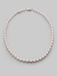 A classic strand of graduated white Akoya pearls with a pretty filigree clasp. 7mm- 9mm white round cultured pearls Quality: A1 18k white gold Length, about 18 Mikimoto signature clasp Imported A classic strand of graduated white Akoya pearls with a pretty filigree clasp. 7mm- 9mm white round cultured pearls Quality: A1 18k white gold Length, about 18 Mikimoto signature clasp Imported