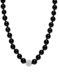 A traditional style with sleek, modern appeal. This smooth strand showcases shiny onyx beads (10 mm) and a sparkling crystal ball at center (12 mm). Clasp crafted in sterling silver. Approximate length: 18 inches. A traditional style with sleek, modern appeal. This smooth strand showcases shiny onyx beads (10 mm) and a sparkling crystal ball at center (12 mm). Clasp crafted in sterling silver. Approximate length: 18 inches.