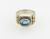 Sterling Silver and Blue Topaz Ring with 18 Karat Gold Accent Size 9