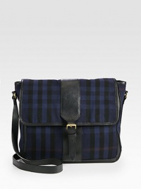 Rendered in vintage washed cotton, this crossbody messenger design is ideal for traveling or weekends on-the-go.Flap, magnetic closureCross body shoulder strapInterior pocketsCanvas liningCotton14W x 14H x 53DMade in Italy Rendered in vintage washed cotton, this crossbody messenger design is ideal for traveling or weekends on-the-go.Flap, magnetic closureCross body shoulder strapInterior pocketsCanvas liningCotton14W x 14H x 53DMade in Italy