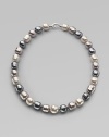 A soft melange of grey, nuage and white baroque man-made pearls creates drama at the neck. 14mm multicolor organic baroque pearls Length, about 20 Sterling silver spring clip clasp Made in Spain