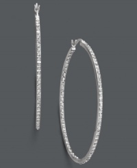 Paparazzi-ready and perfectly chic. Dozens of round-cut diamond accents reflect the light in these stunning large hoop earrings. Set in sterling silver. Approximate diameter: 1-3/4 inches. Paparazzi-ready and perfectly chic. Dozens of round-cut diamond accents reflect the light in these stunning large hoop earrings. Set in sterling silver. Approximate diameter: 1-3/4 inches.