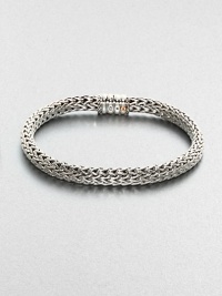 An intricately woven design,from the Bedeg Collection, set in sterling silver and 18kt-gold.Sterling silver/18kt-goldAbout 3 diam.Imported An intricately woven design,from the Bedeg Collection, set in sterling silver and 18kt-gold.Sterling silver/18kt-goldAbout 3 diam.Imported