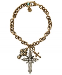 Crossover appeal. This charm bracelet from Lucky Brand features three cross charms, all crafted from gold- and silver-tone mixed metal, as well as turquoise bead for color. Approximate length: 7-1/2 inches. Crossover appeal. This charm bracelet from Lucky Brand features three cross charms, all crafted from gold- and silver-tone mixed metal, as well as turquoise bead for color. Approximate length: 7-1/2 inches.