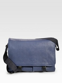 Sporty, yet sophisticated, rendered in grained calfskin leather.Flap, buckle closureAdjustable shoulder strapExterior, interior pocketsFully lined14¼W x 10½H x 5¼DMade in Italy Sporty, yet sophisticated, rendered in grained calfskin leather.Flap, buckle closureAdjustable shoulder strapExterior, interior pocketsFully lined14¼W x 10½H x 5¼DMade in Italy