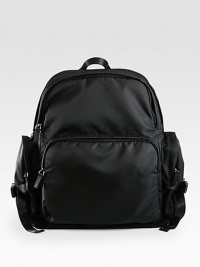 Smooth tessuto nylon backpack with large exterior zip pockets, open interior pockets, two compartments and adjustable back straps for extended support.Zip closureTop handleBack strapsExterior, interior pockets and compartmentsNylon15W x 14H x 6DMade in Italy Smooth tessuto nylon backpack with large exterior zip pockets, open interior pockets, two compartments and adjustable back straps for extended support.Zip closureTop handleBack strapsExterior, interior pockets and compartmentsNylon15W x 14H x 6DMade in Italy