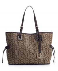 Signature style: Logo jacquard fabric makes this refined tote purse unmistakably Calvin Klein. Signature style: Logo jacquard fabric makes this refined tote purse unmistakably Calvin Klein.